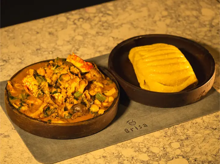 A Nigerian soup served with swallow on a Brisa place mat